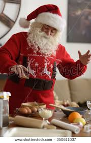 Santa being filmed on Santa Cam cooking